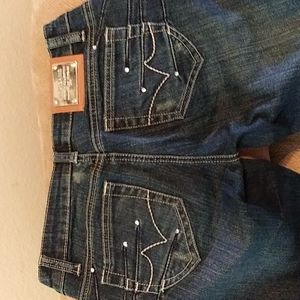 VIRGIN ONLY DARK WASH JEANS SIZE 3.DETAIL ON BACK POCKETS AND ON FRONT AT WAIST